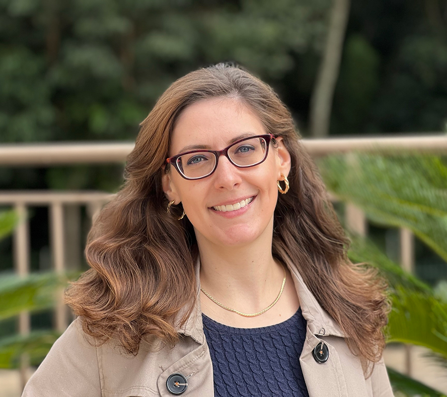 Manuela Gortz wears a brown coat in a background of trees